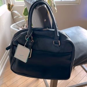 Brand new Shoraleah bag with tags. Has defects due to being stored